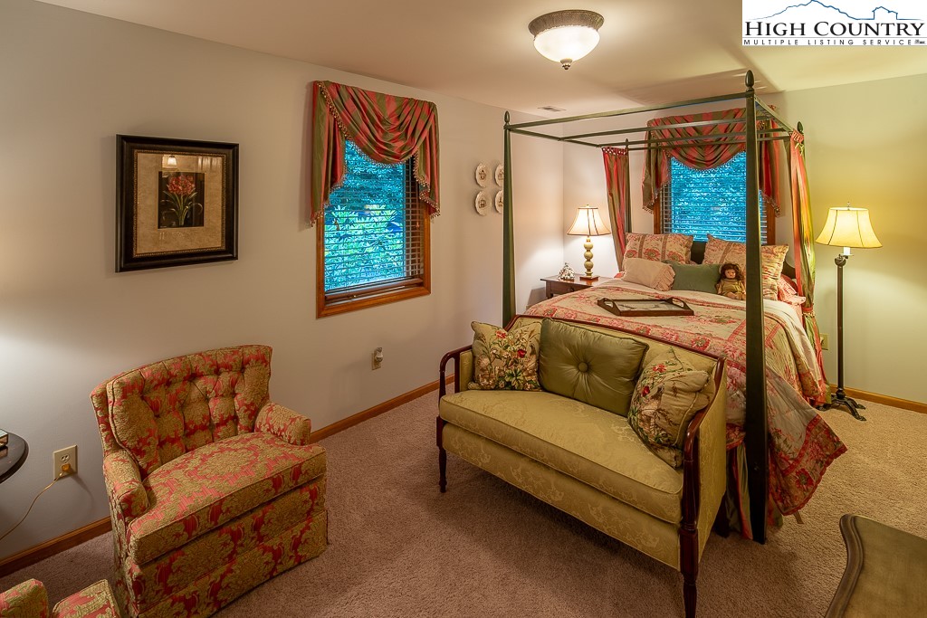 127 Apple Tree Boone, NC 28607 - Photo 31 of 50 a bedroom with furniture and a window