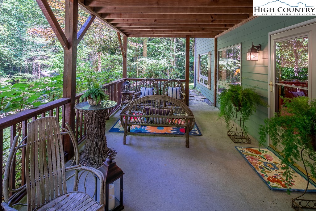 127 Apple Tree Boone, NC 28607 - Photo 41 of 50 a view of a porch with wooden floor