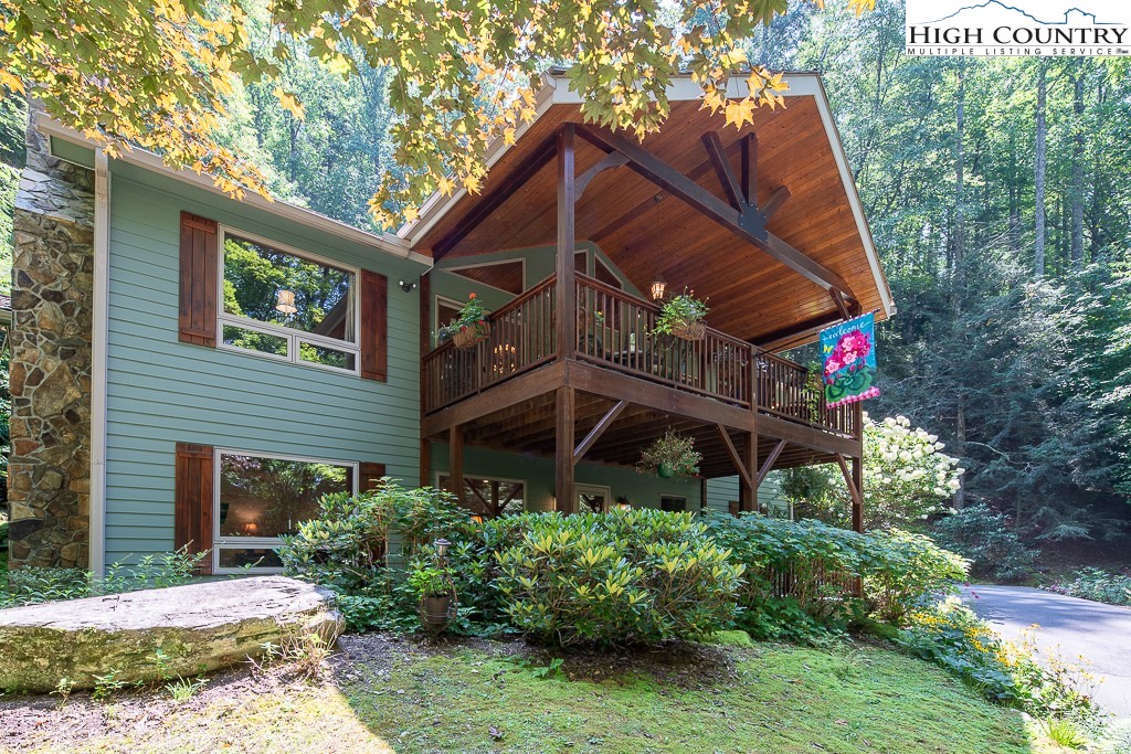 127 Apple Tree Boone, NC 28607 - Photo 49 of 50 a view of a house that has a small yard and a large tree