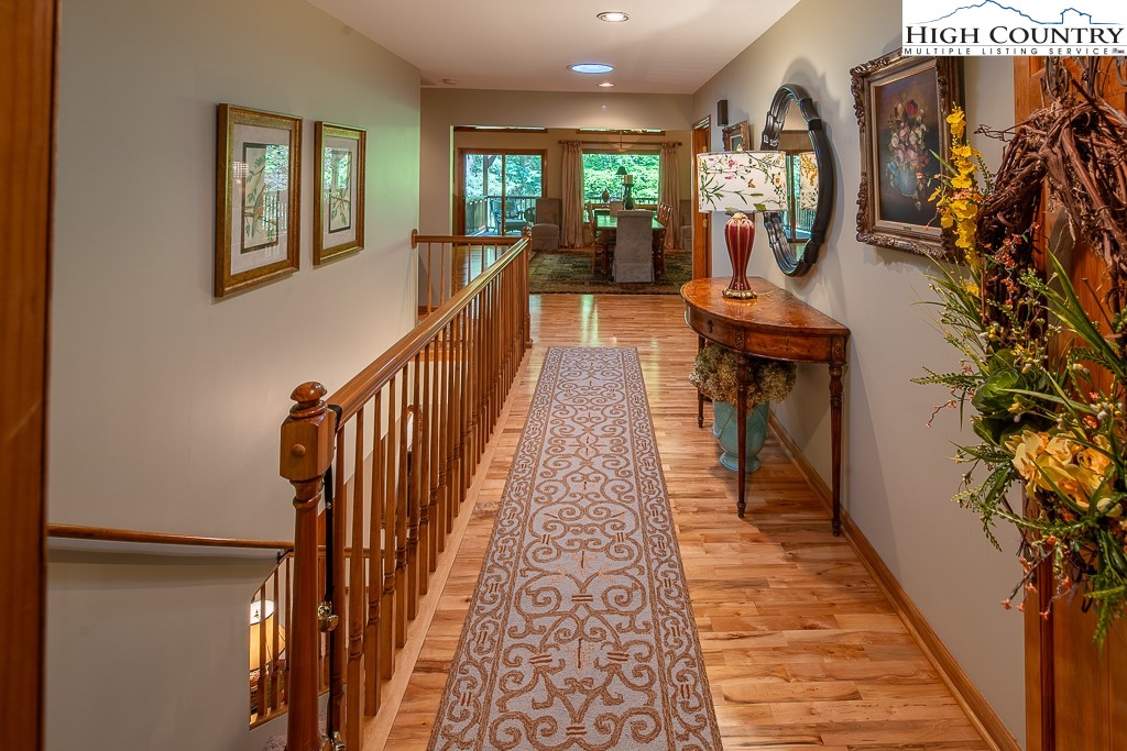 127 Apple Tree Boone, NC 28607 - Photo 7 of 50 a view of entryway and hall with wooden floor
