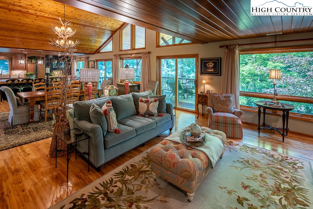 127 Apple Tree Boone, NC 28607 - Photo 9 of 50 a living room with furniture a fireplace and a large window