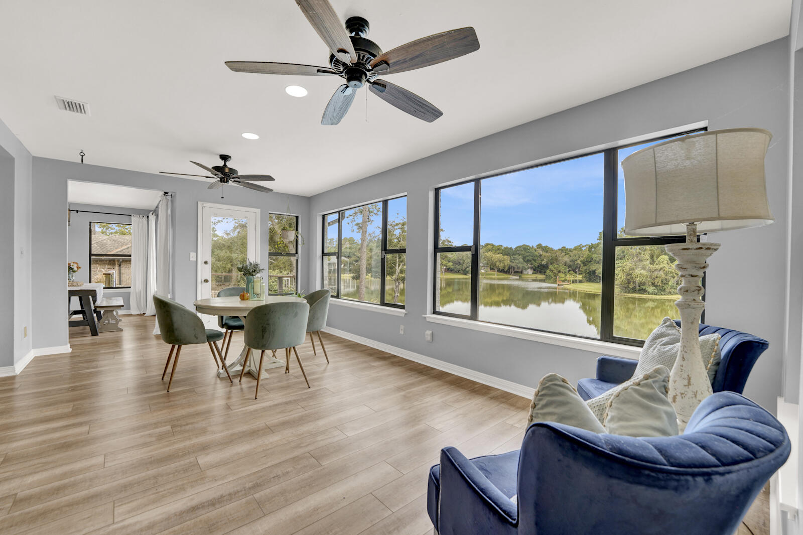 340 Ruckel Drive Niceville, FL 32578 - Photo 12 of 66 a dining room with furniture a chandelier and wooden floor