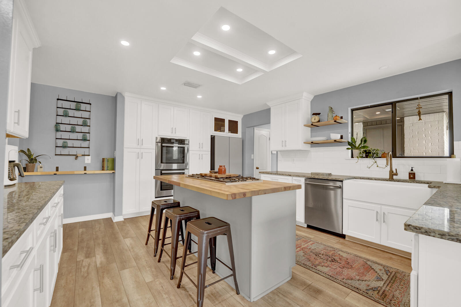 340 Ruckel Drive Niceville, FL 32578 - Photo 15 of 66 a kitchen with stainless steel appliances granite countertop a sink stove and refrigerator