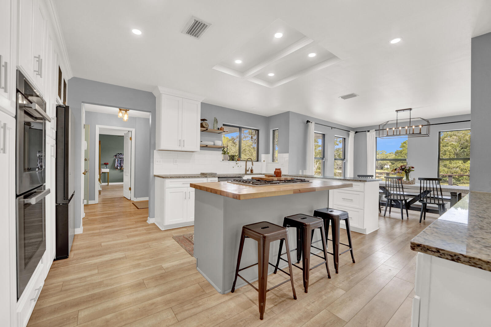 340 Ruckel Drive Niceville, FL 32578 - Photo 16 of 66 a kitchen with stainless steel appliances granite countertop a refrigerator and a stove top oven