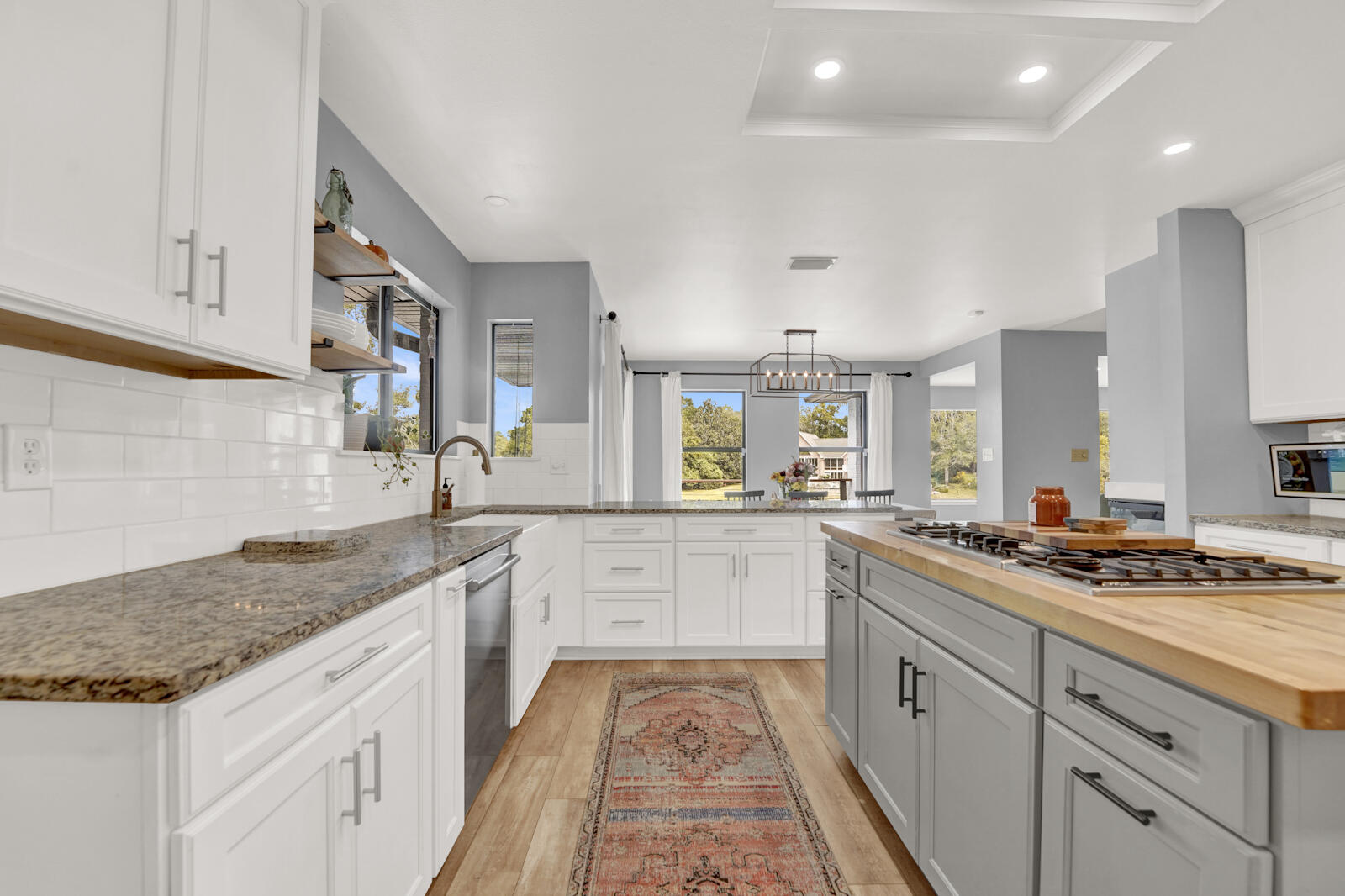 340 Ruckel Drive Niceville, FL 32578 - Photo 17 of 66 a kitchen with stainless steel appliances granite countertop a sink stove and cabinets
