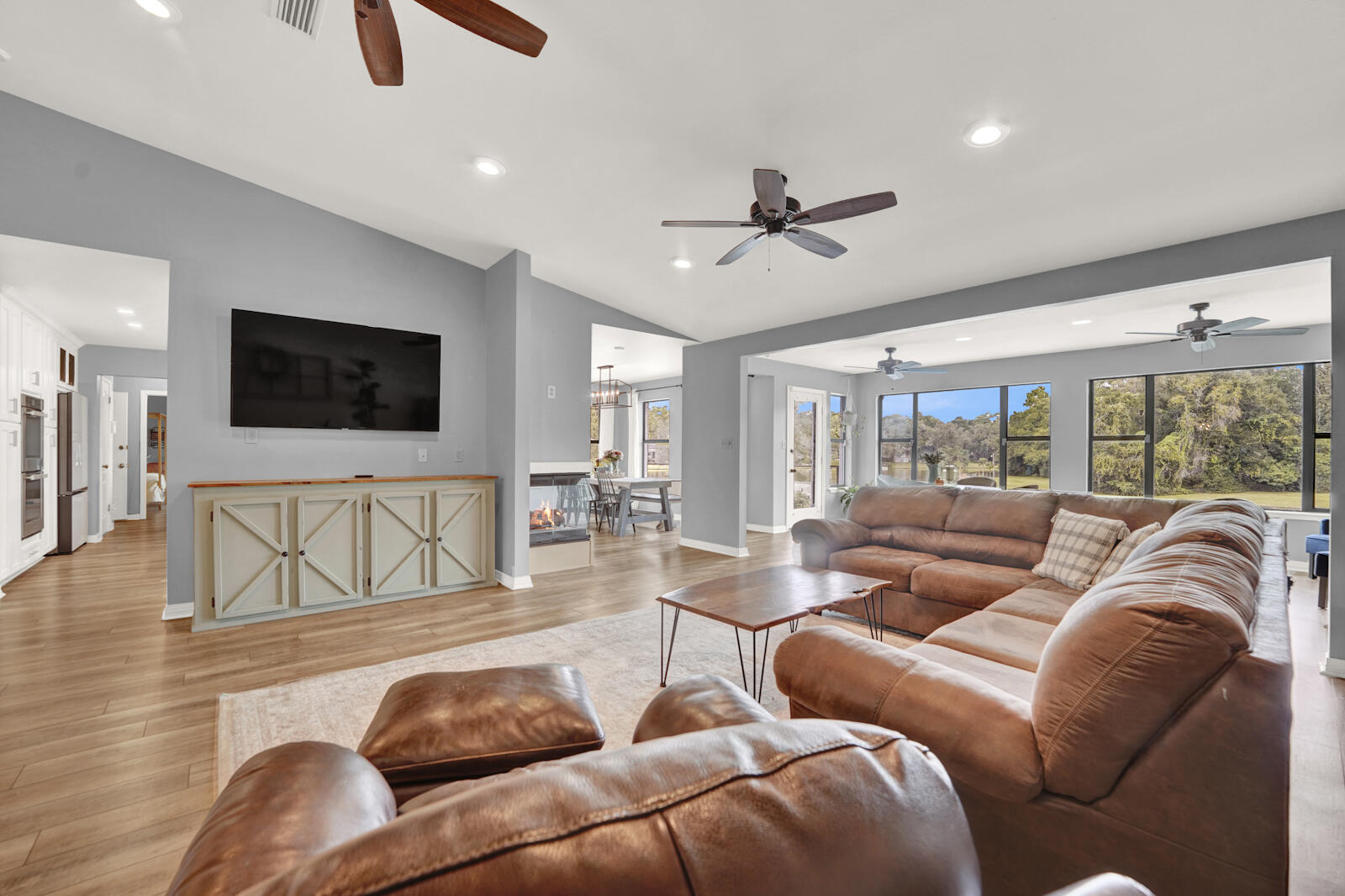 340 Ruckel Drive Niceville, FL 32578 - Photo 3 of 66 a living room with furniture and a flat screen tv