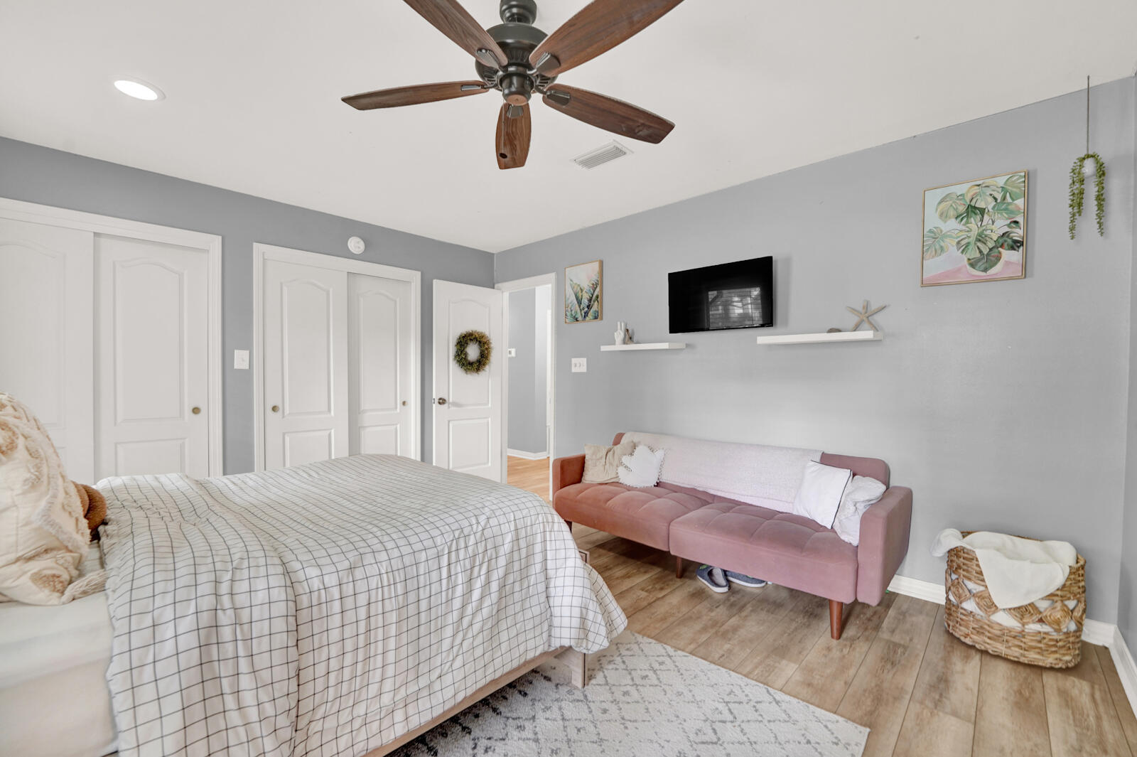 340 Ruckel Drive Niceville, FL 32578 - Photo 32 of 66 a bedroom with a bed and a chandelier