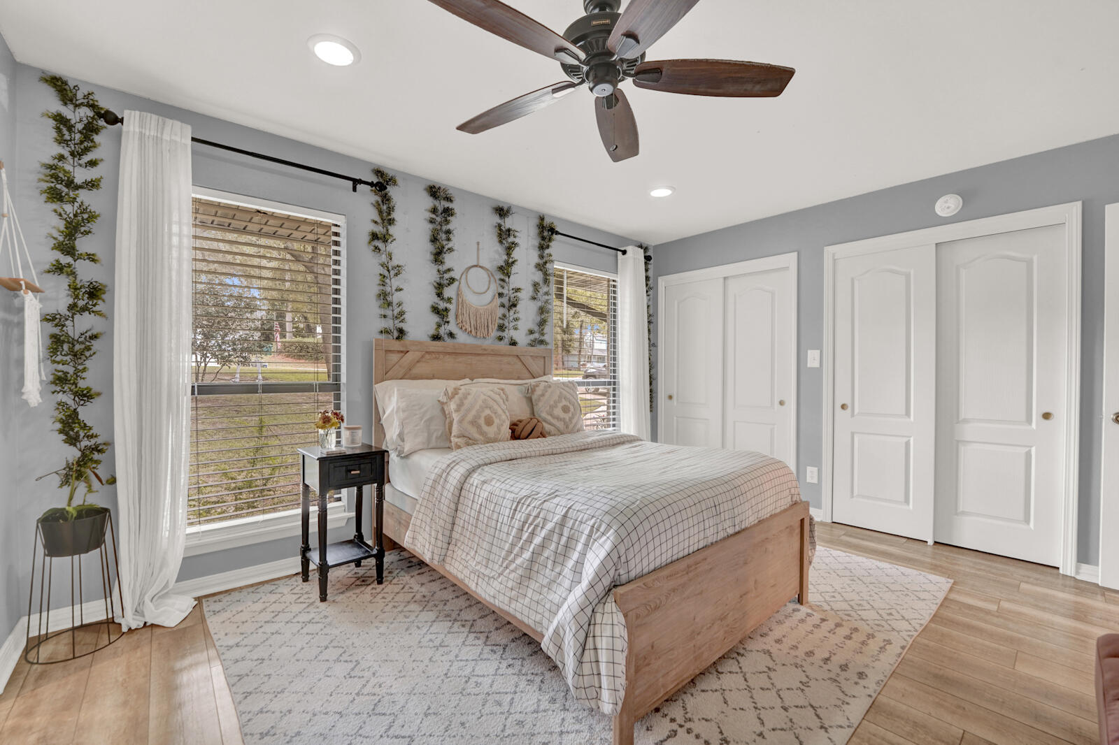 340 Ruckel Drive Niceville, FL 32578 - Photo 33 of 66 a bedroom with a large bed and a chandelier