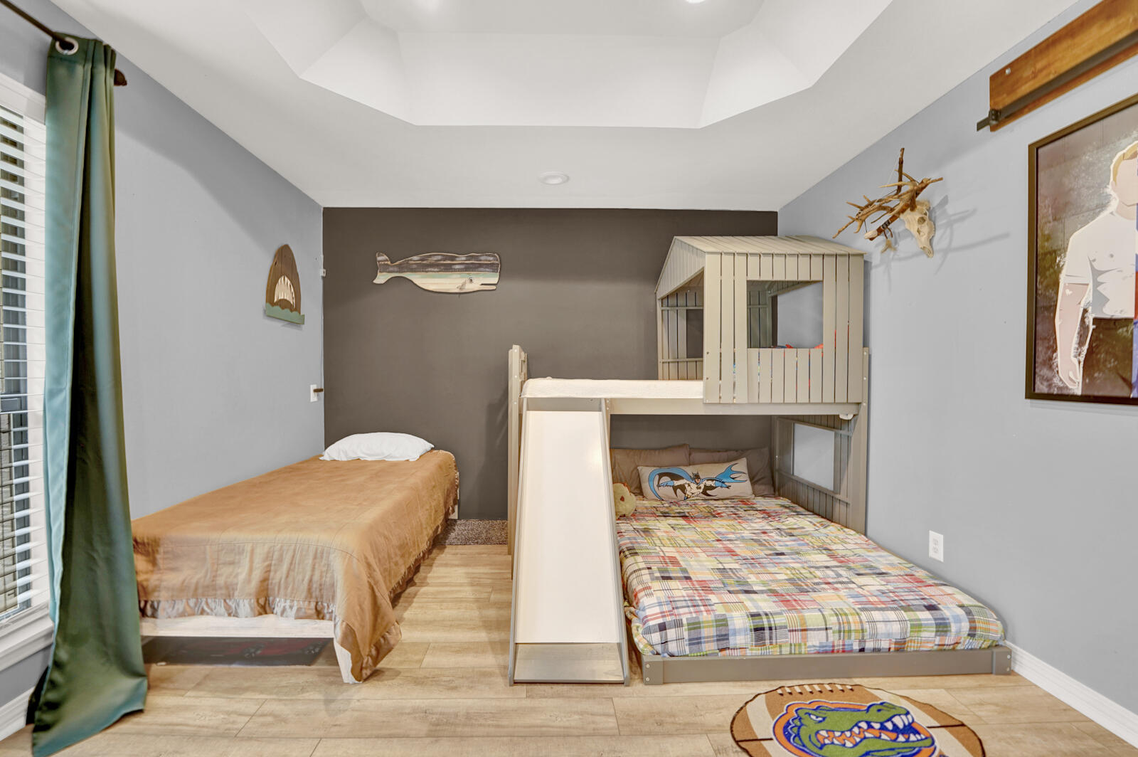 340 Ruckel Drive Niceville, FL 32578 - Photo 41 of 66 a bedroom with a bed and wooden floor