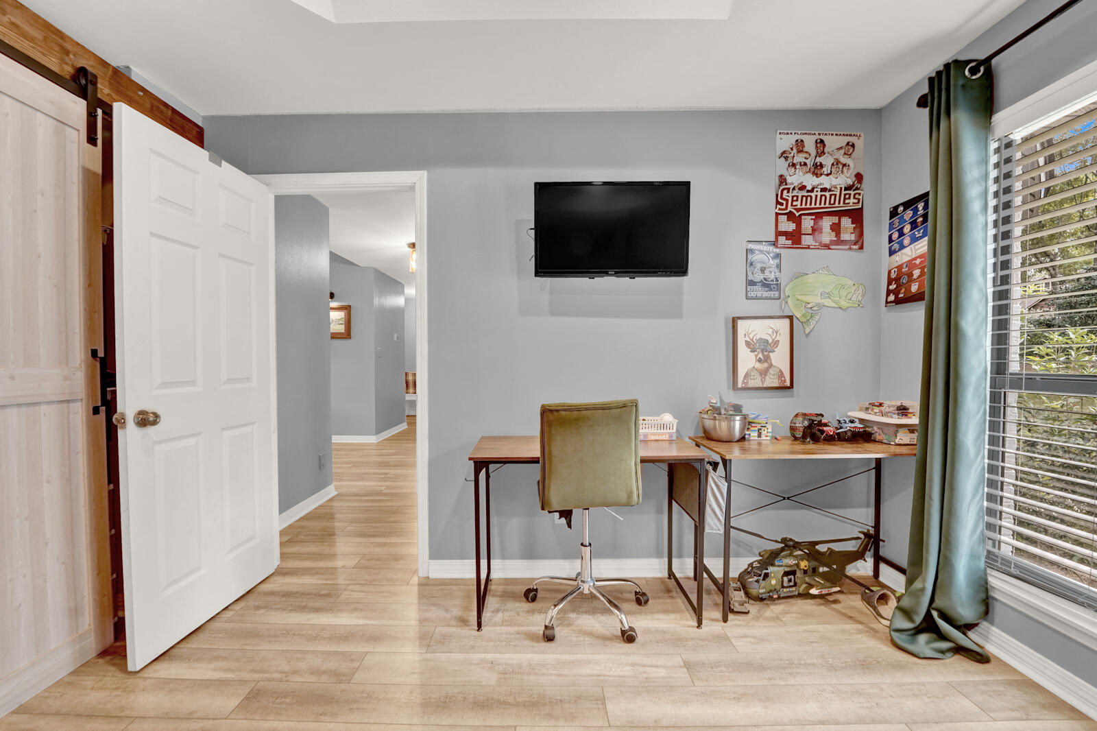 340 Ruckel Drive Niceville, FL 32578 - Photo 42 of 66 a workspace with wooden floor and white walls