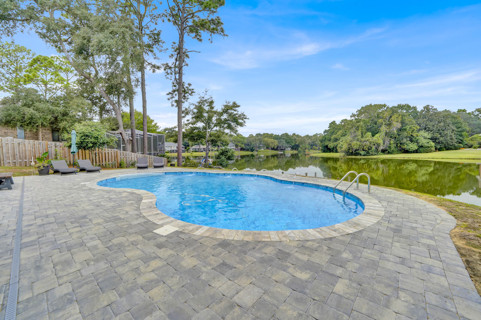 340 Ruckel Drive Niceville, FL 32578 - Photo 58 of 66 a view of a swimming pool with an outdoor space and seating area