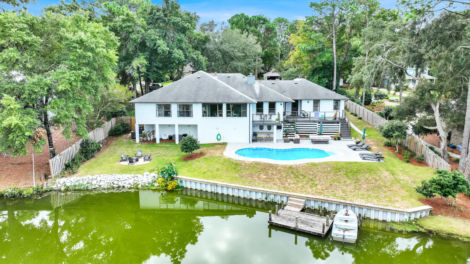 340 Ruckel Drive Niceville, FL 32578 - Photo 63 of 66 a view of a house with swimming pool and sitting area