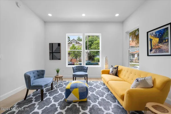 a living room with furniture and a large window
