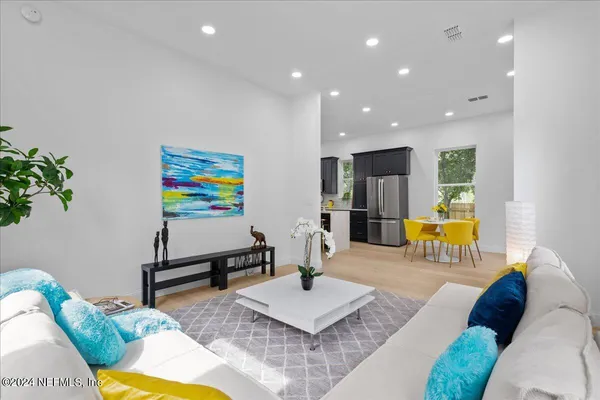 a living room with furniture and a table