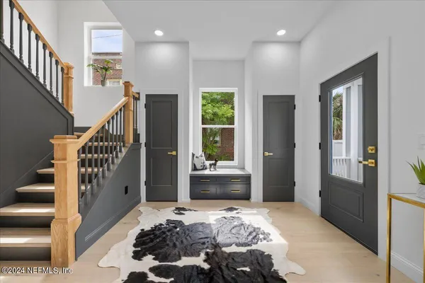 a bedroom with furniture and a window