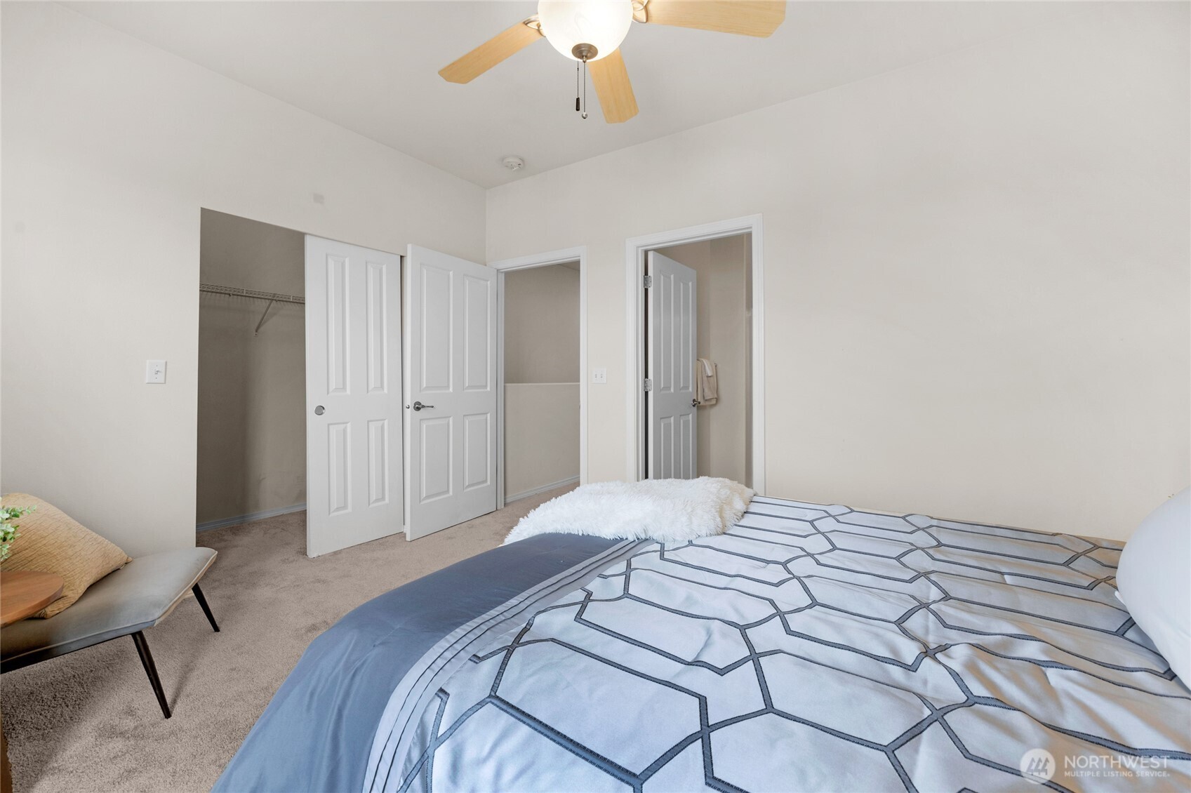 14915 38th Drive Southeast, Unit JJ1180 Bothell, WA 98012 - Photo 23 of 38 a bedroom with a bed and a chandelier