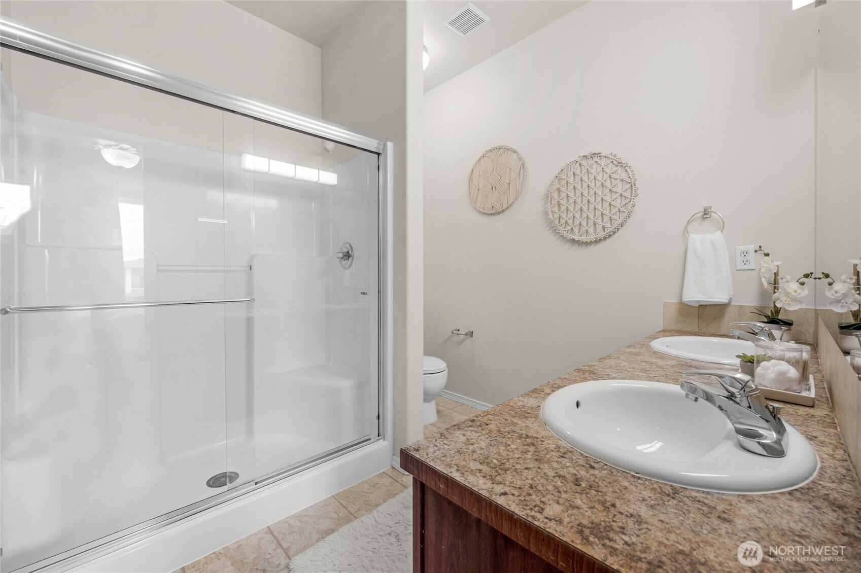 14915 38th Drive Southeast, Unit JJ1180 Bothell, WA 98012 - Photo 24 of 38 a bathroom with a granite countertop sink a mirror and shower
