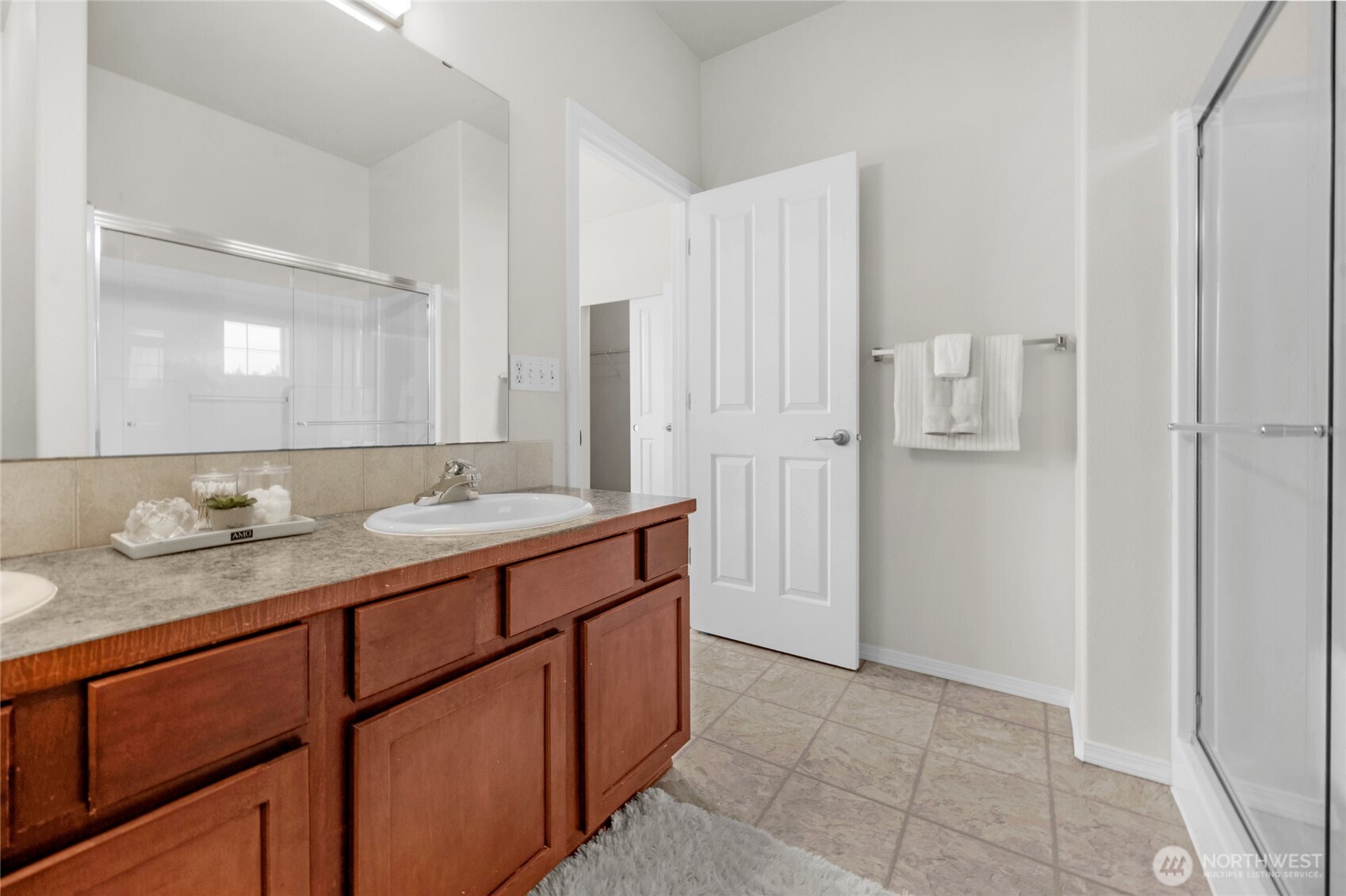 14915 38th Drive Southeast, Unit JJ1180 Bothell, WA 98012 - Photo 25 of 38 a bathroom with a granite countertop sink and a mirror