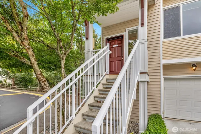 a view of a balcony with wooden stairs