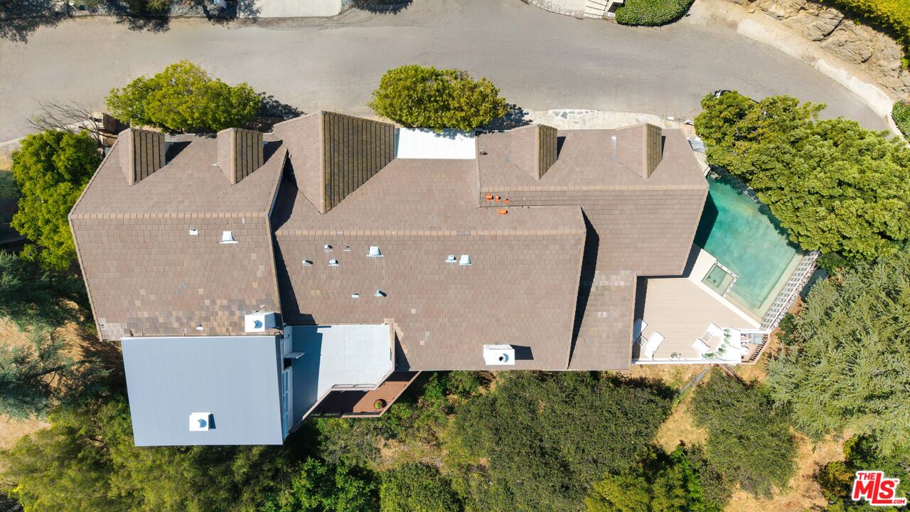 2312 Kimridge Road Beverly Hills, CA 90210 - Photo 2 of 60 an aerial view of a house with yard and swimming pool