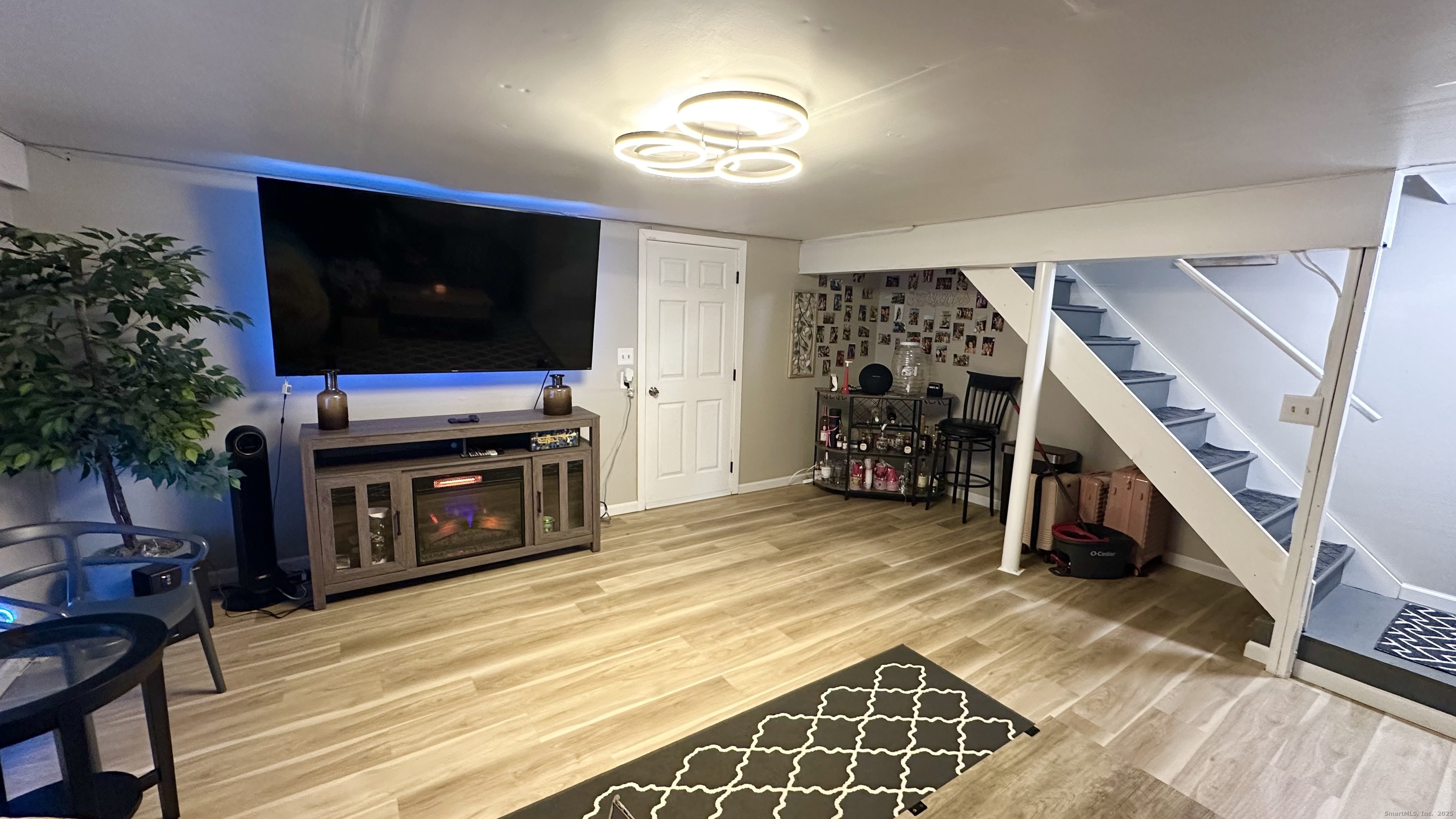 105 Tremont Avenue, Unit B Bridgeport, CT 06606 - Photo 22 of 24 a view of a livingroom with furniture and a flat screen tv