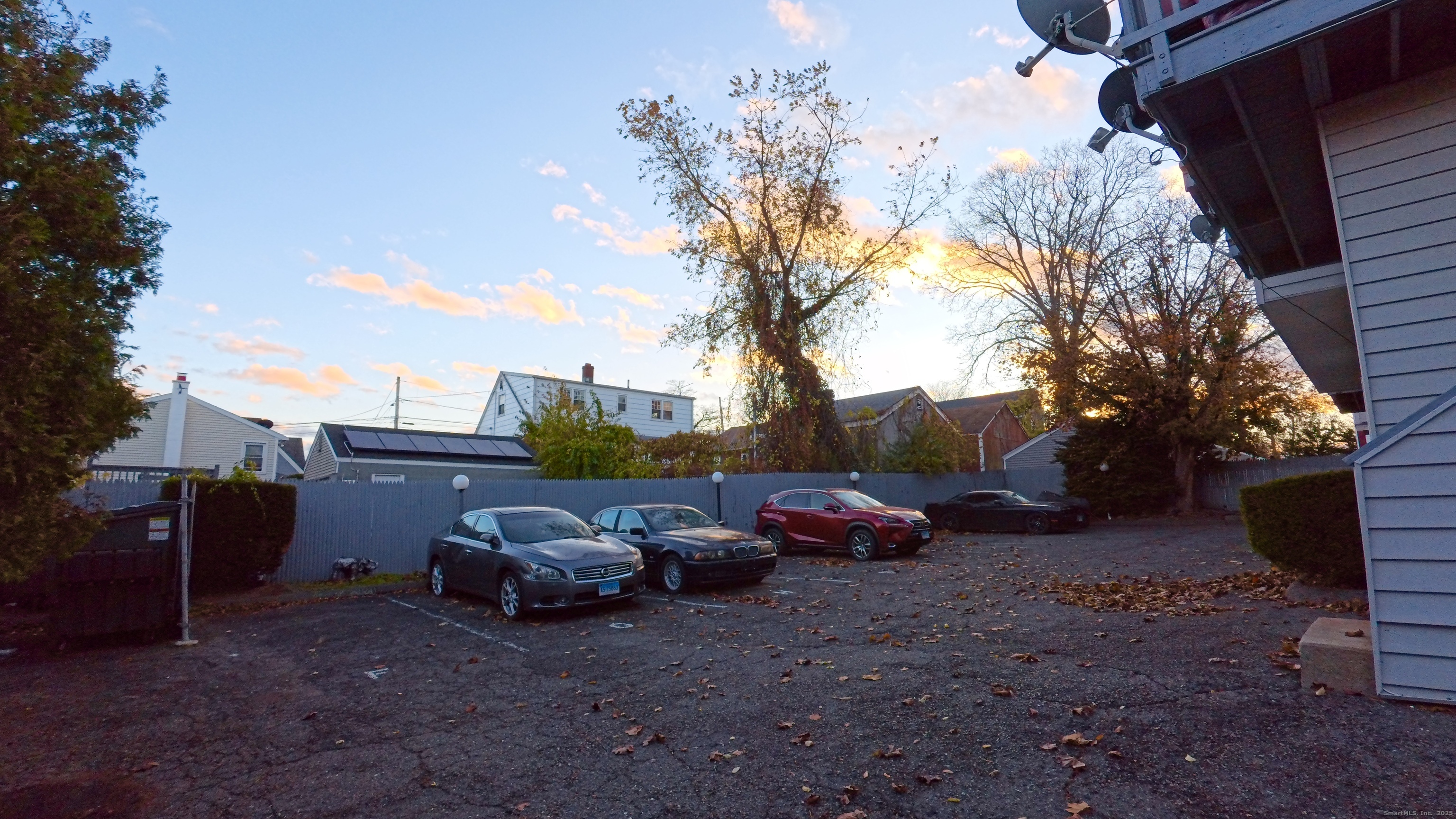 105 Tremont Avenue, Unit B Bridgeport, CT 06606 - Photo 5 of 24 a view of backyard with parked cars