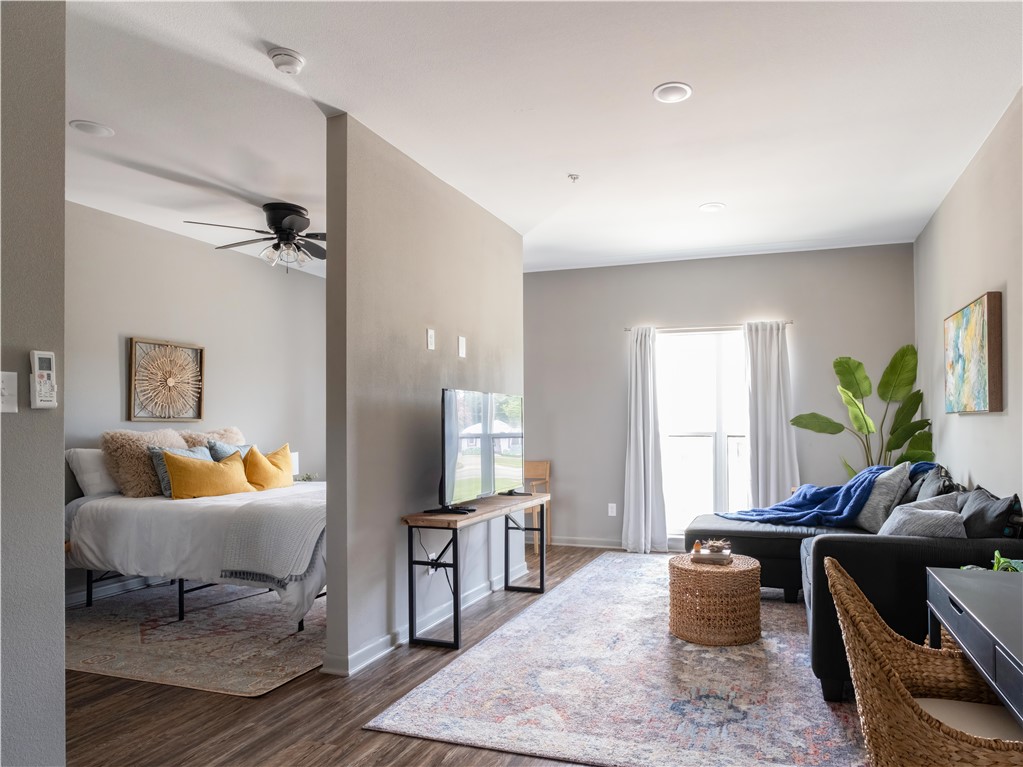 101 West 33rd Street, Unit 103 Bryan, TX 77803 - Photo 9 of 14 a living room with furniture and a window