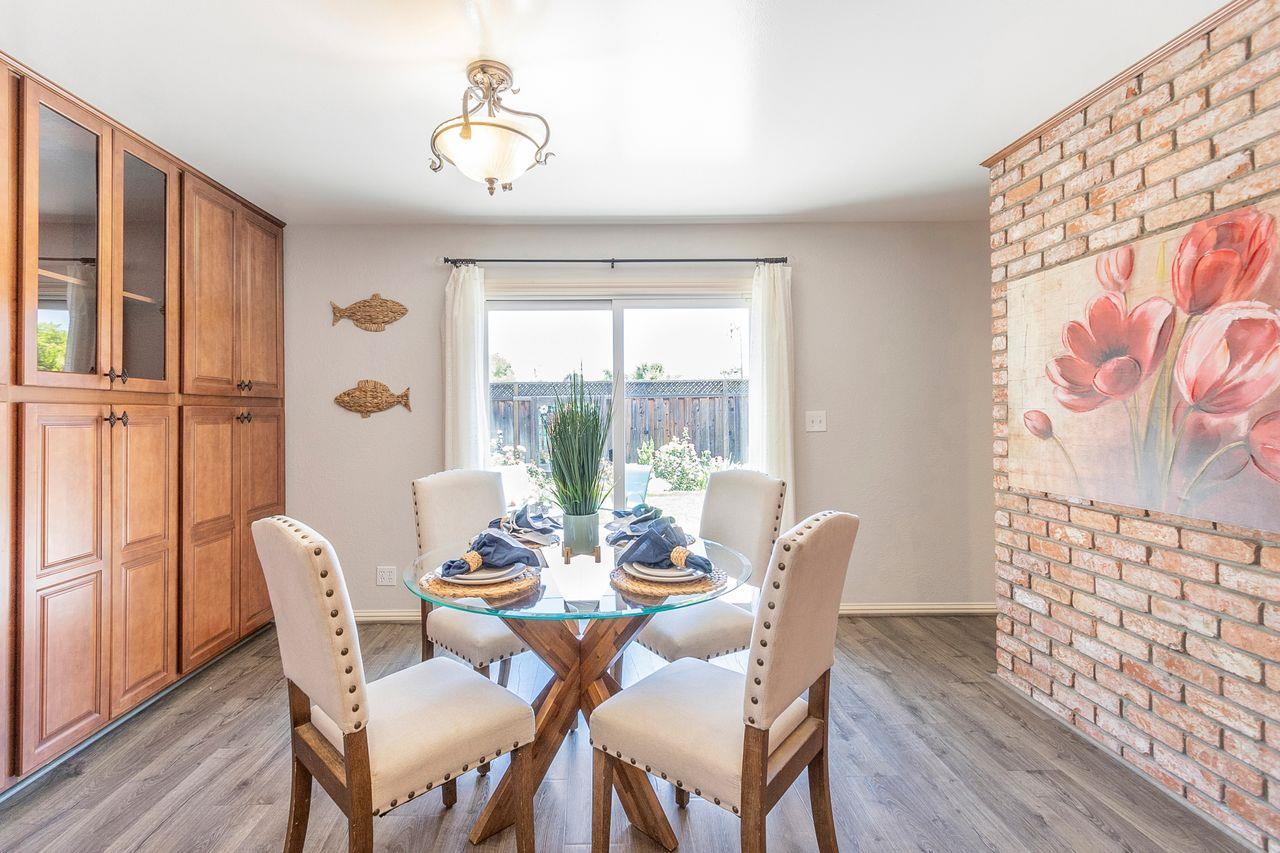 616 Sobrato Drive Campbell, CA 95008 - Photo 13 of 27 a dining room with furniture a chandelier and wooden floor
