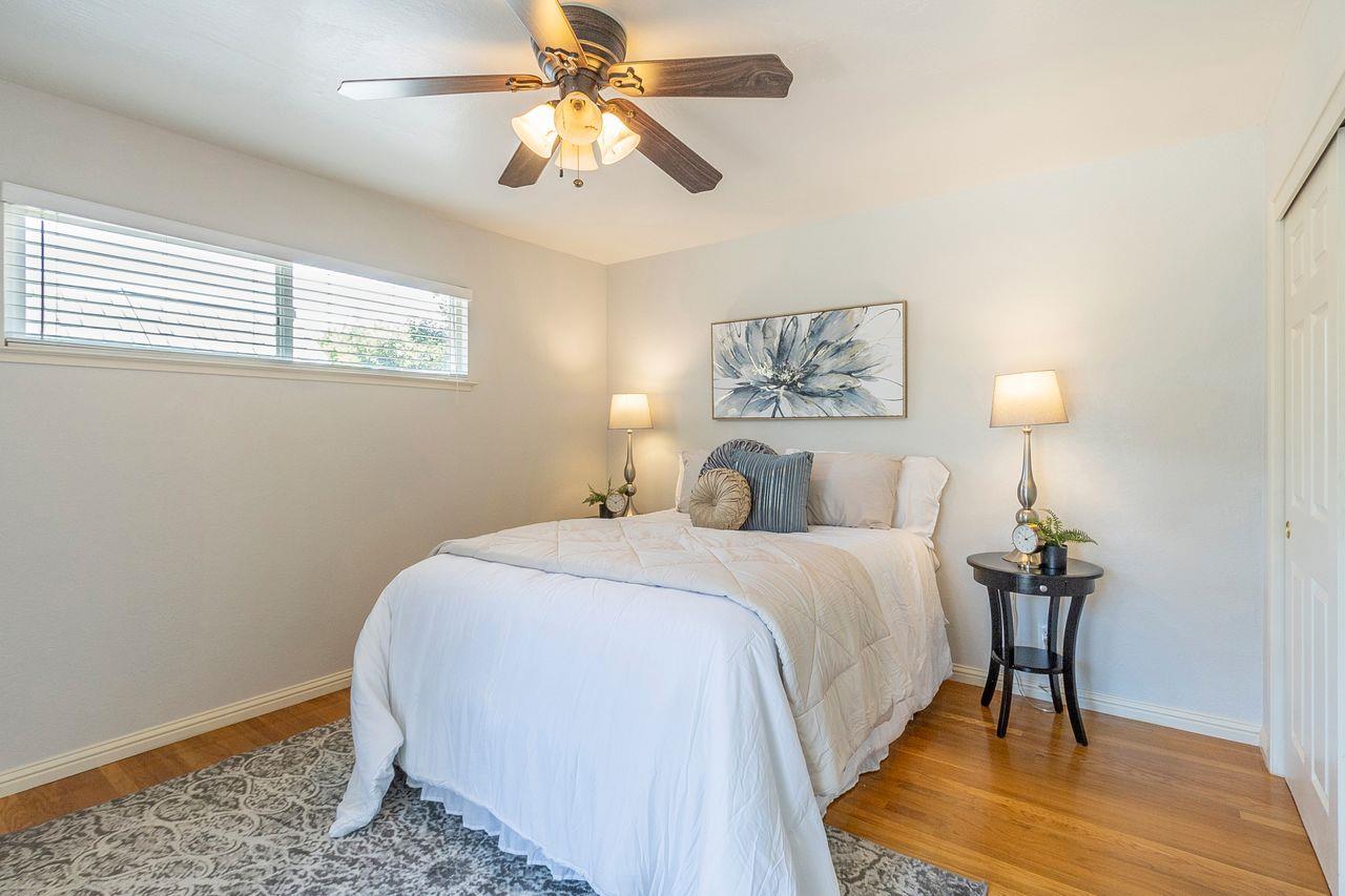 616 Sobrato Drive Campbell, CA 95008 - Photo 18 of 27 a bedroom with a bed and a chandelier