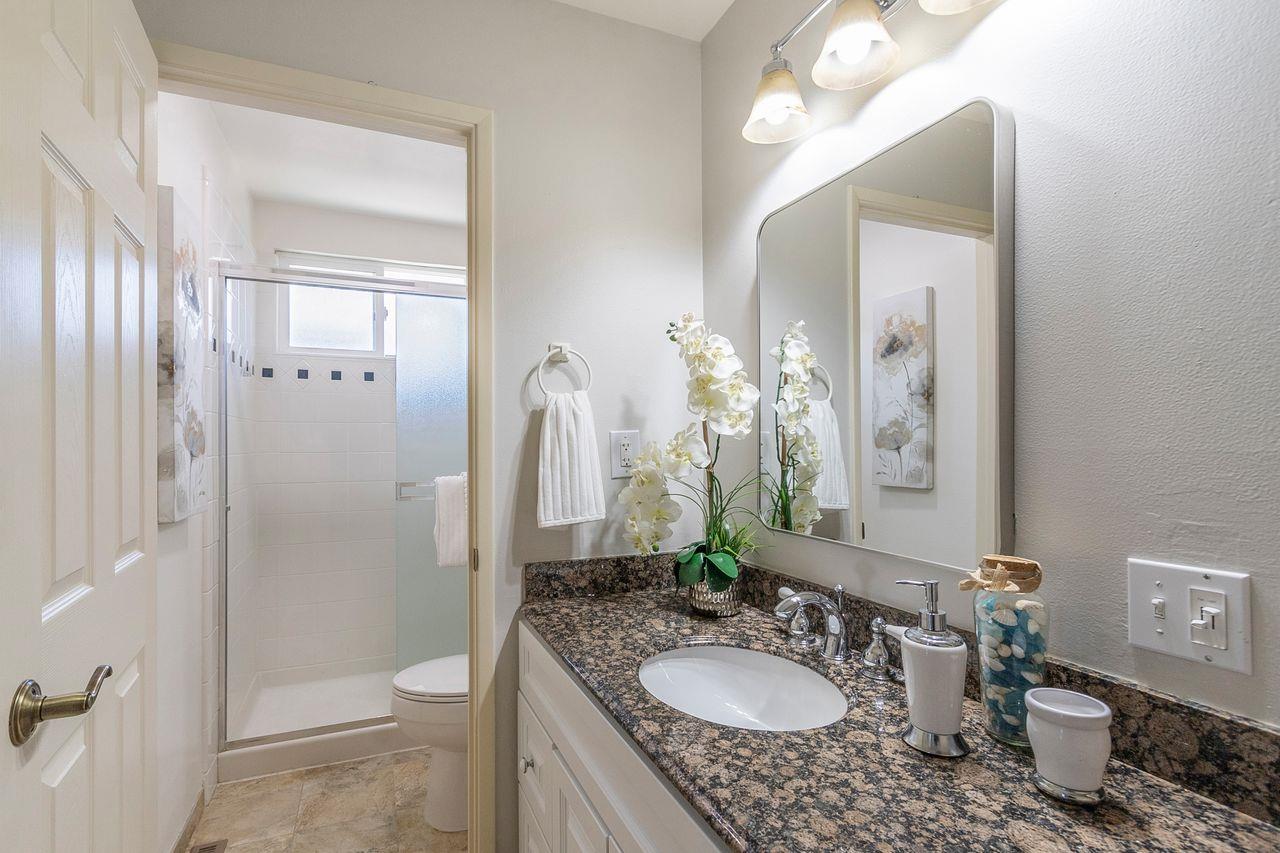 616 Sobrato Drive Campbell, CA 95008 - Photo 20 of 27 a bathroom with a granite countertop sink a toilet and a mirror