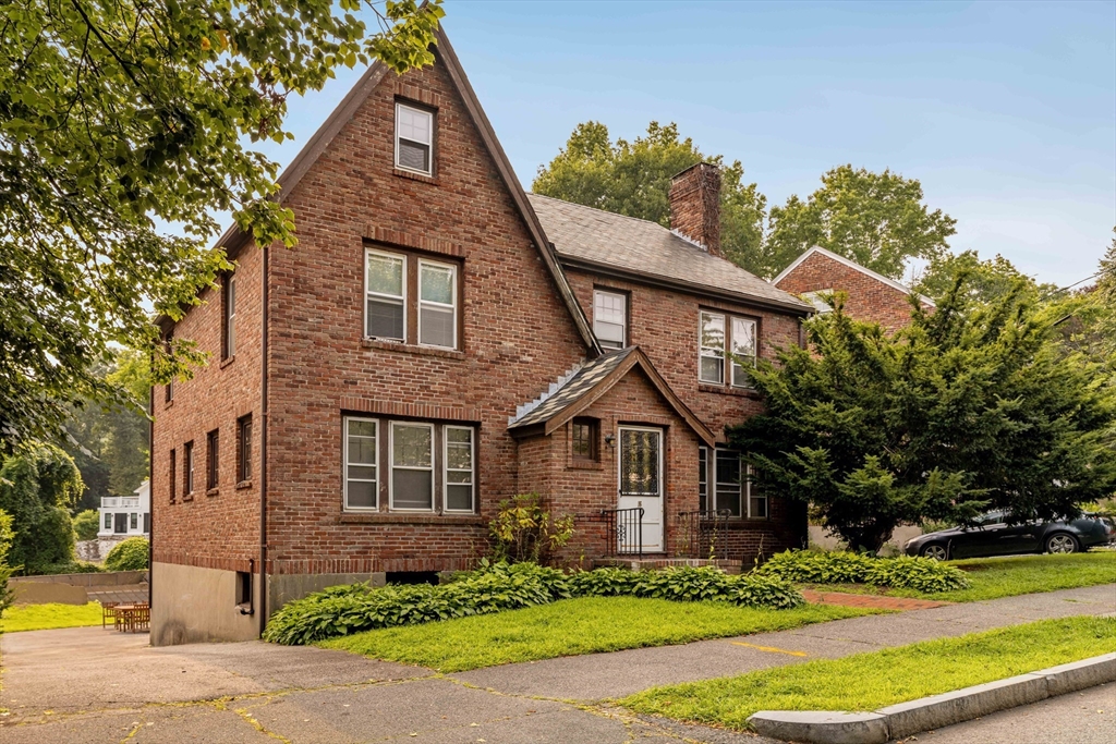 16 Blake Road Brookline, MA 02445 - Photo 2 of 12 a front view of a house with a yard