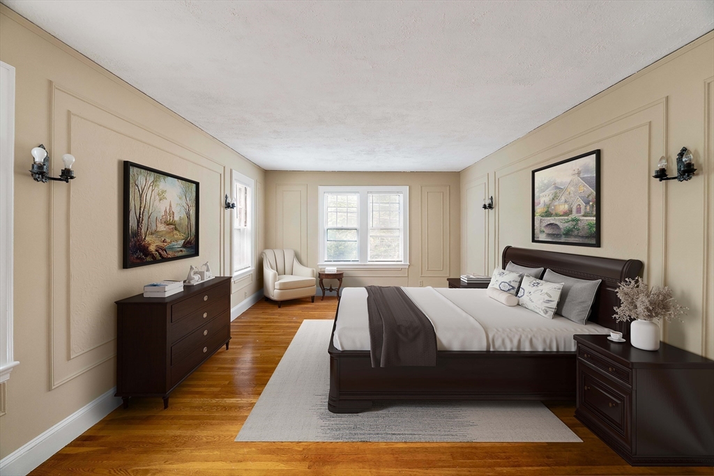 16 Blake Road Brookline, MA 02445 - Photo 5 of 12 a large bedroom with a bed and wooden floor
