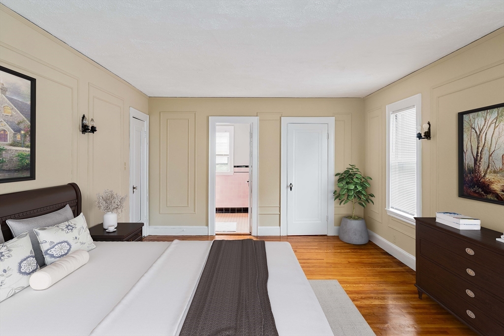 16 Blake Road Brookline, MA 02445 - Photo 6 of 12 a bedroom with a bed and a flat screen television