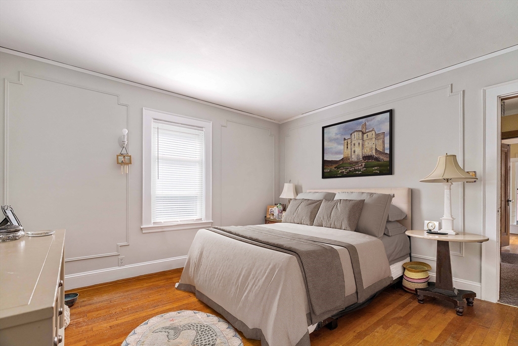 16 Blake Road Brookline, MA 02445 - Photo 7 of 12 a bedroom with a bed and a window