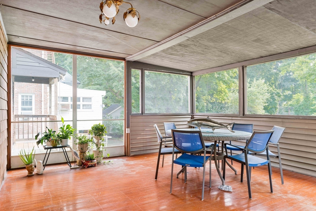 16 Blake Road Brookline, MA 02445 - Photo 8 of 12 a view of a dining room with furniture window and wooden floor