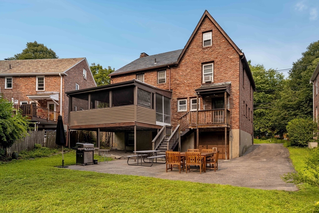 16 Blake Road Brookline, MA 02445 - Photo 9 of 12 a view of a house with patio