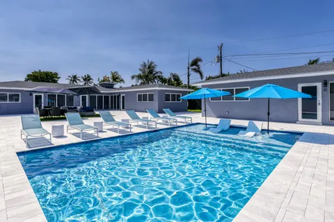 a view of a swimming pool with a patio