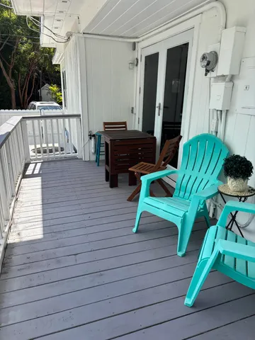 a view of balcony with furniture