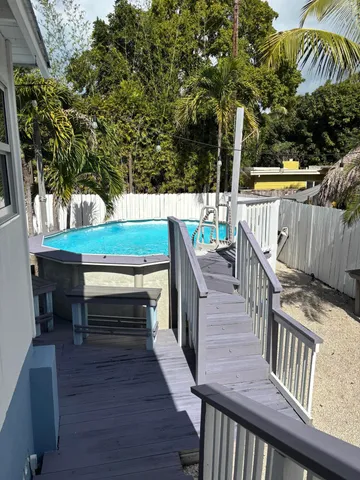 a view of outdoor with deck and outdoor seating