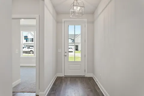 an empty room that has a window in it