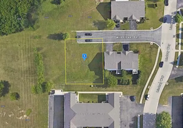 an aerial view of a house with a garden