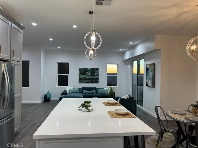 a kitchen with a table and chairs in it