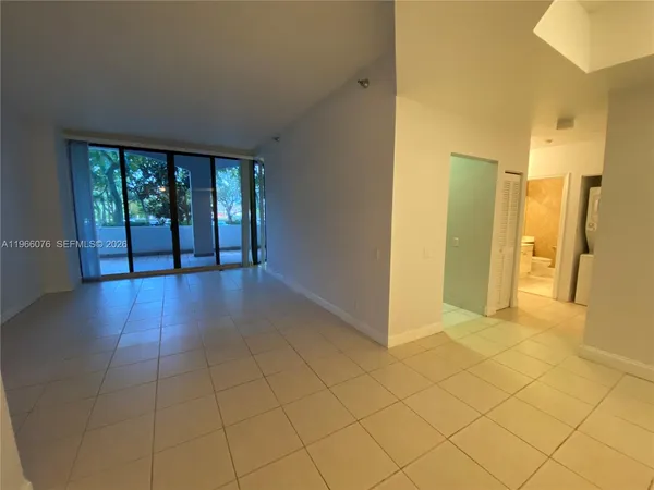 a kitchen with sink a window and cabinets
