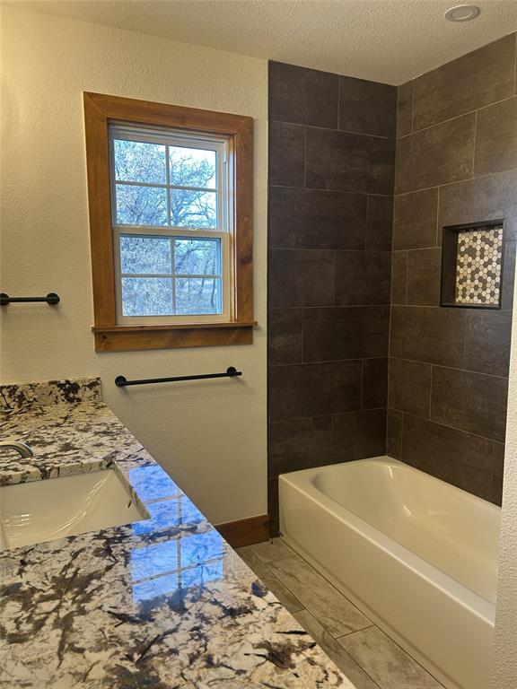 307 County Road 4790 Boyd, TX 76023 - Photo 17 of 25 a bathroom with a bathtub and shower