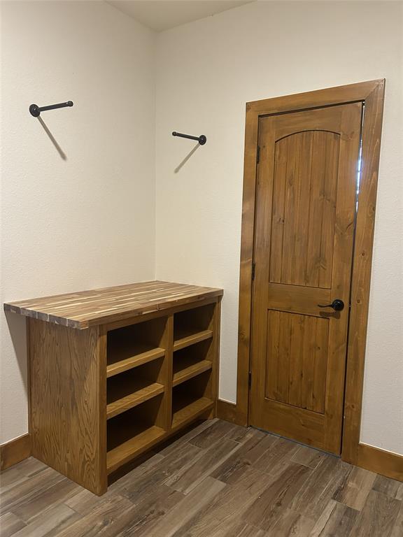 307 County Road 4790 Boyd, TX 76023 - Photo 19 of 25 a view of an empty room and wooden floor