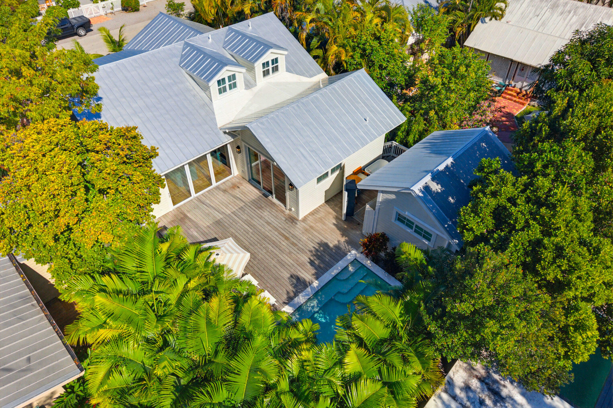 an aerial view of a house with a yard and garden