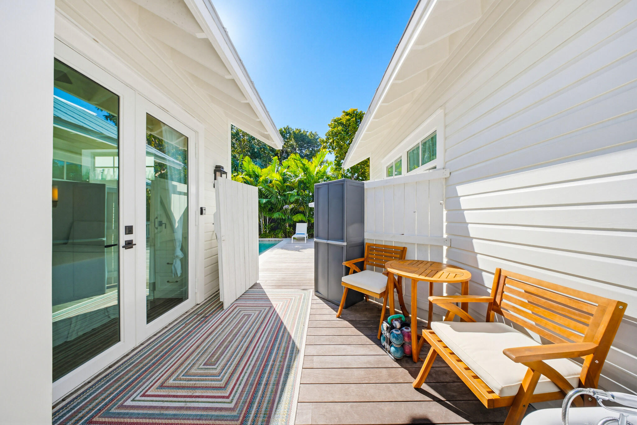 1230 South Street Key West, FL 33040 - Photo 50 of 60 a balcony with wooden floor table and chairs