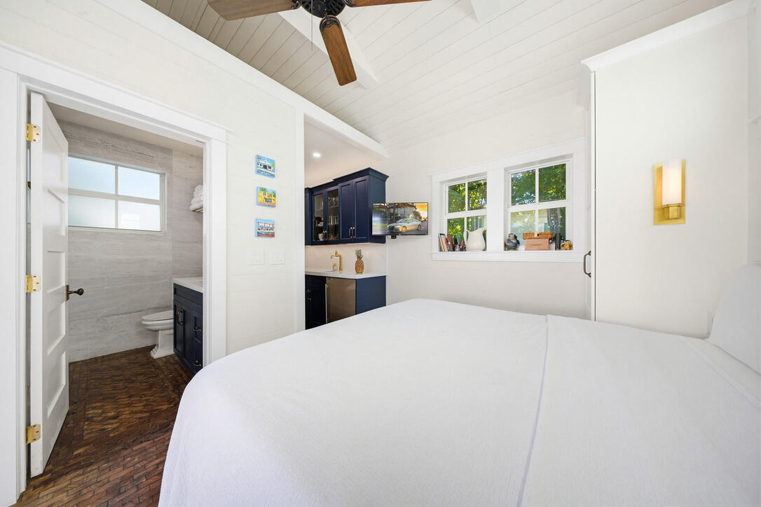 1230 South Street Key West, FL 33040 - Photo 55 of 60 a large bedroom with a large bed and a large window