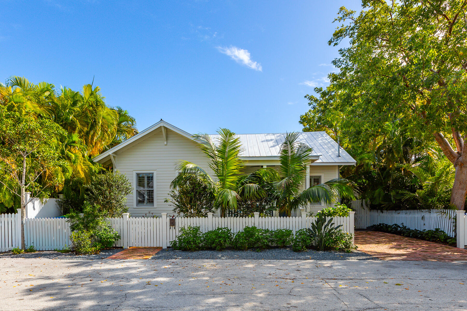 1230 South Street Key West, FL 33040 - Photo 59 of 60 a front view of a house with a yard and potted plants