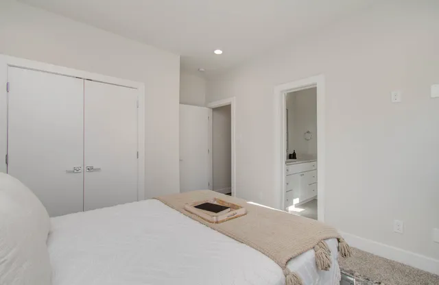 a bedroom with a bed and a closet